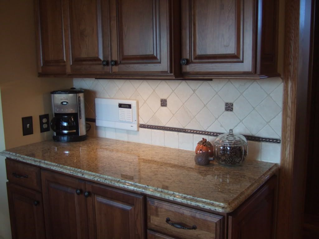Does anyone have new venetian gold and tumbled marble backsplash?
