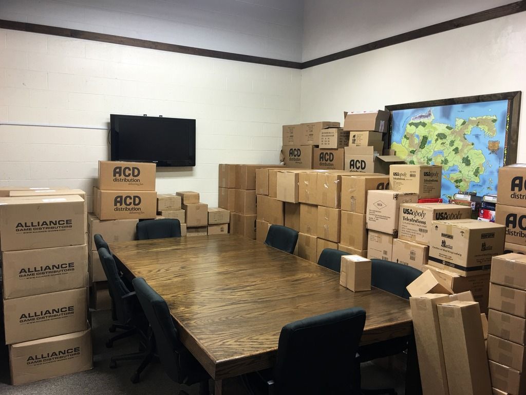 Some of the boxes full of games for PAX East 2016 in our back gaming room at Battleground